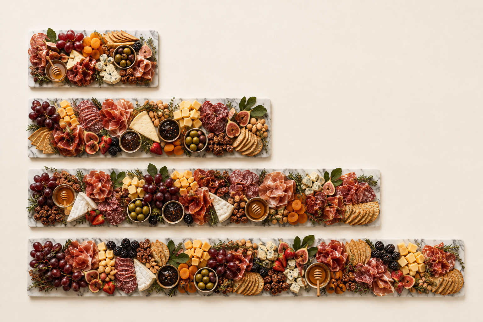 Four marble charcuterie runners of increasing length, from a single-serving board to a full grazing-table runner